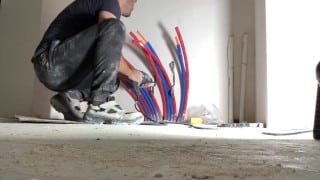 Perverted plumber gets horny while he’s working on radiator plumbing in construction